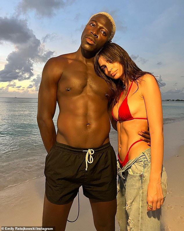 Cozy: She later put on a cosy display with hunky singer-songwriter Moses Sumney, 30, as she embraced him