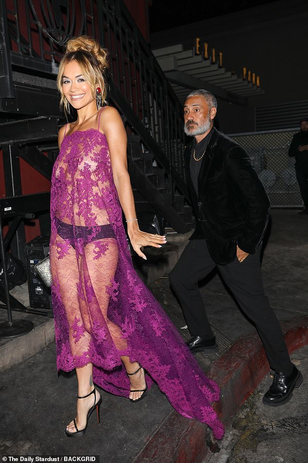 The King: Ora's better half, 47, donned a velvet black blazer over a dark gray button-down shirt and matching pants