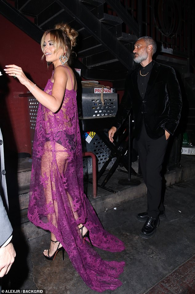 Backside: She added a pair of tiny black underwear to her outfit which clutched her impressive backside