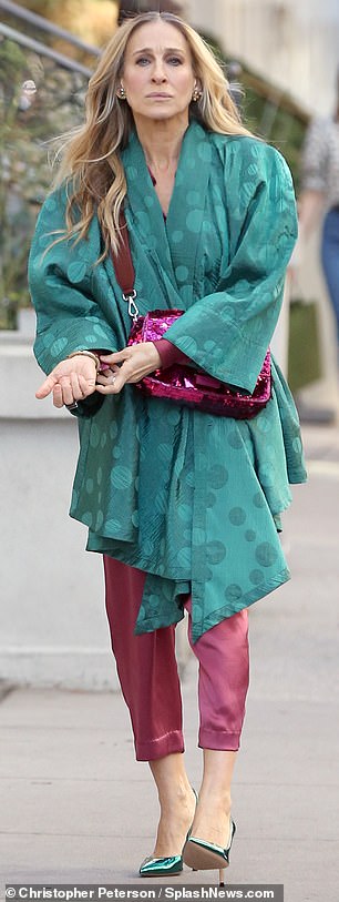 Fashion icon: She wore a magenta Fendi shoulder bag adorned with sequins across her body