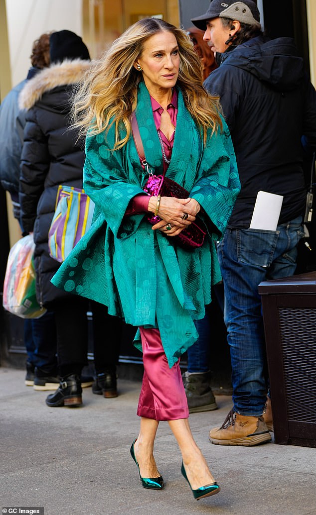 Showing off: She wore pants stopped at the mid-calf length and metallic green pointed-toe stiletto heels to show off her legs