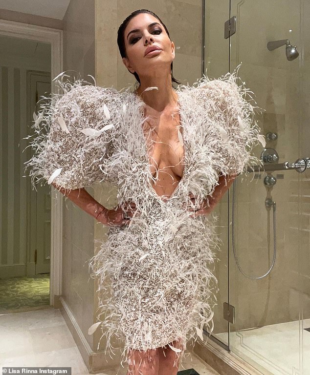 Busty: Lisa Rinna flaunted her fantastic figure in an Ashi Studio dress for Paris Fashion Week