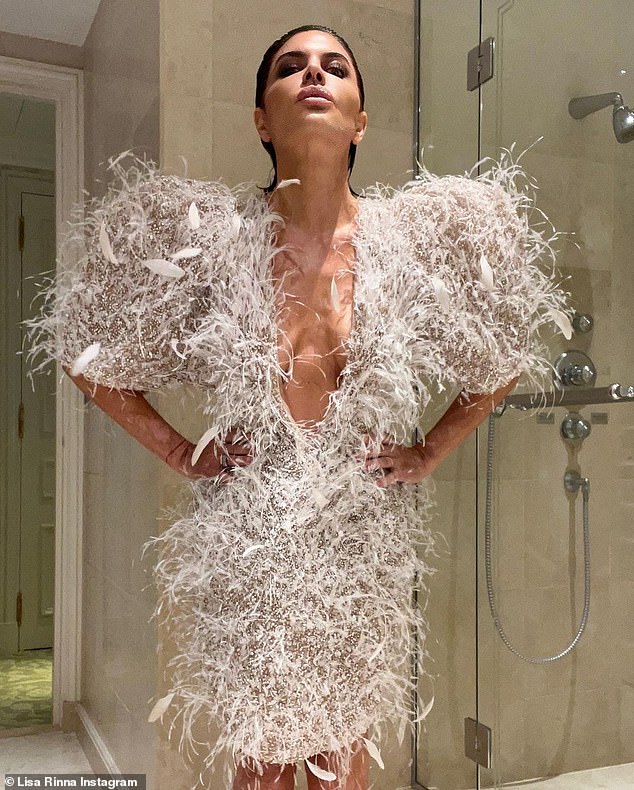 Figure: The 59-year-old struck several poses in her hotel bathroom to show off her stunning outfit