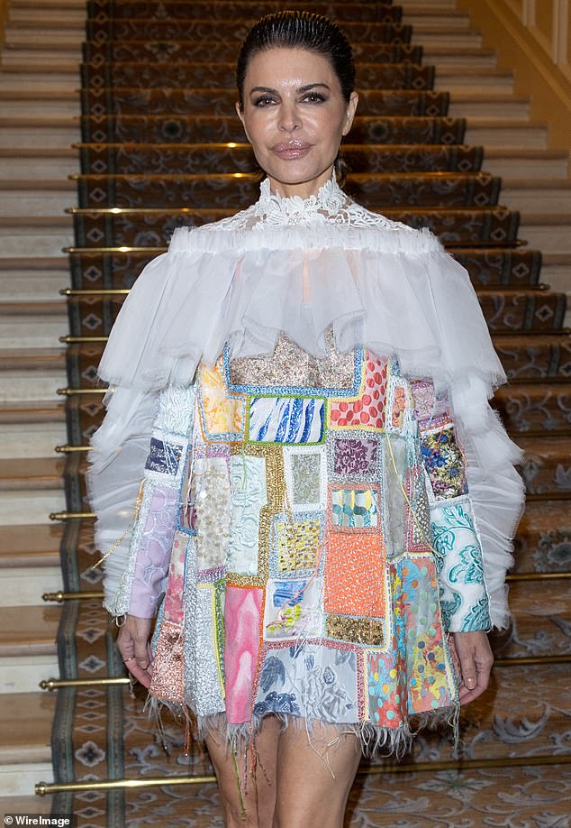 Vintage look: She also went to the Viktor & Rolf Haute Couture Spring Summer 2023 show sporting an off-the-shoulder patchwork dress made out of different colored fabrics