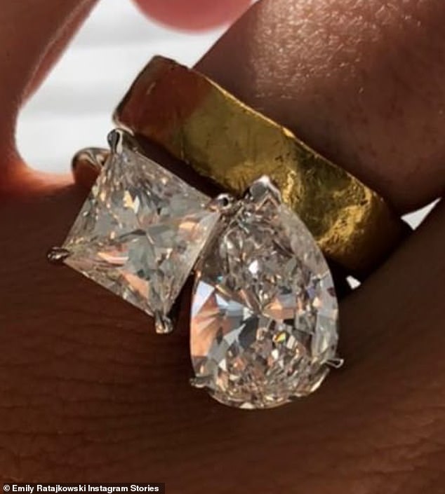 A big deal: The ring is two-carat princess-cut diamond and a three-carat pear-shaped diamond on a yellow gold band and worth about $50K