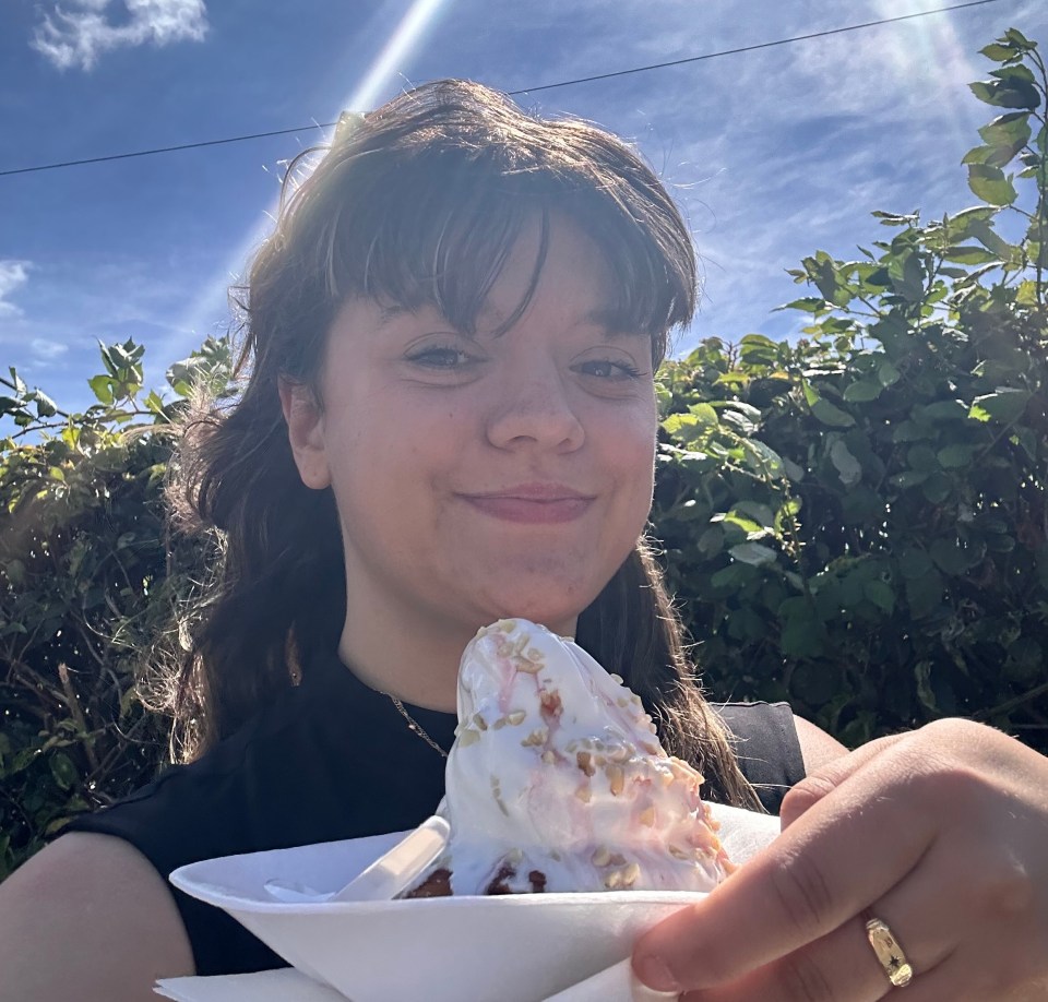 Cyann Fielding in Windsor and Canvey island holding a dessert.