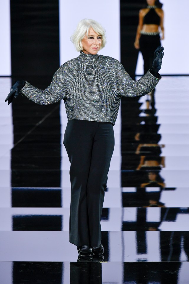 Helen Mirren on the runway at the Le Défilé 2025: A Celebration of Women's Empowerment fashion show.