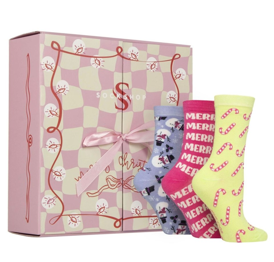 Sock Shop advent calendar and three pairs of Christmas-themed socks.