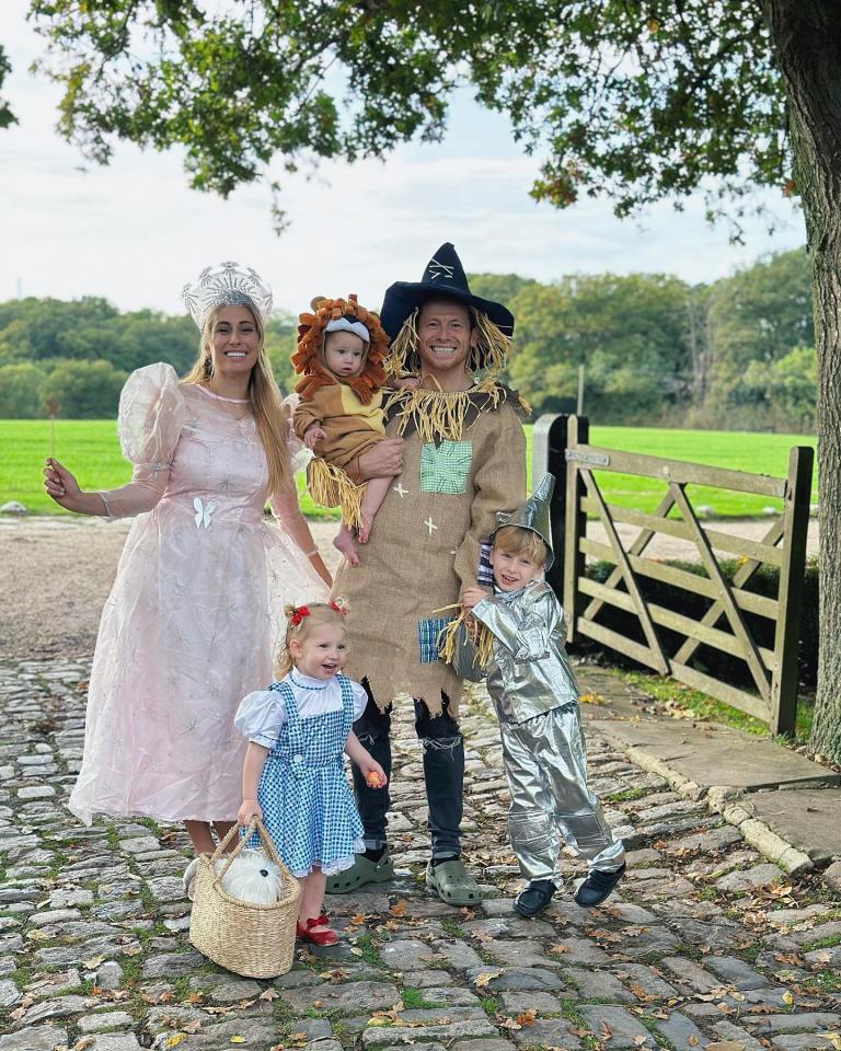 A family dressed as characters from The Wizard of Oz for Halloween.