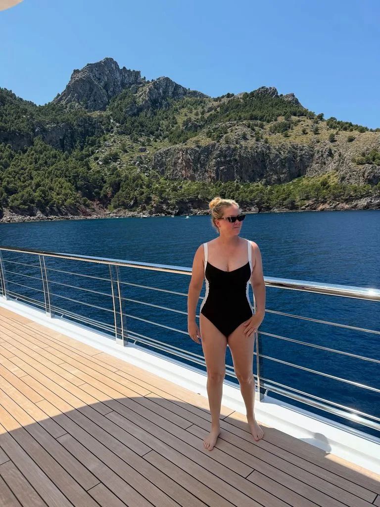 The actress stunned in a black swimsuit aboard a yacht