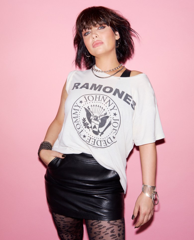 Shona McGarty wearing a Ramones t-shirt and leather skirt.