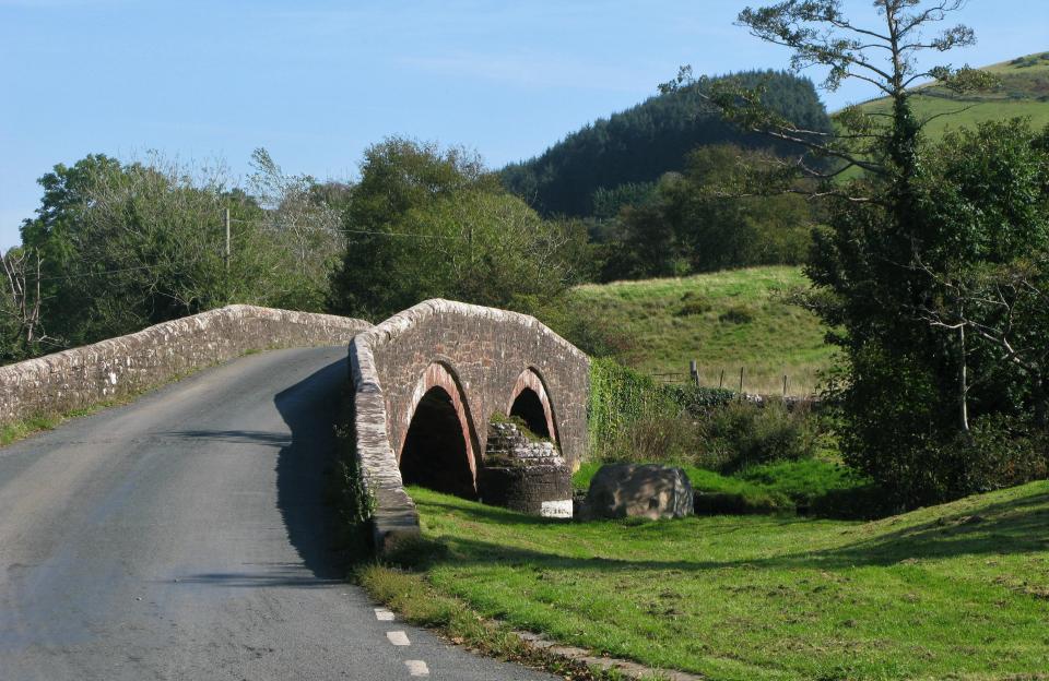 The stone arch bridge over the River Ehen, Cleator Moor, Cumbria, England, United Kingdom.