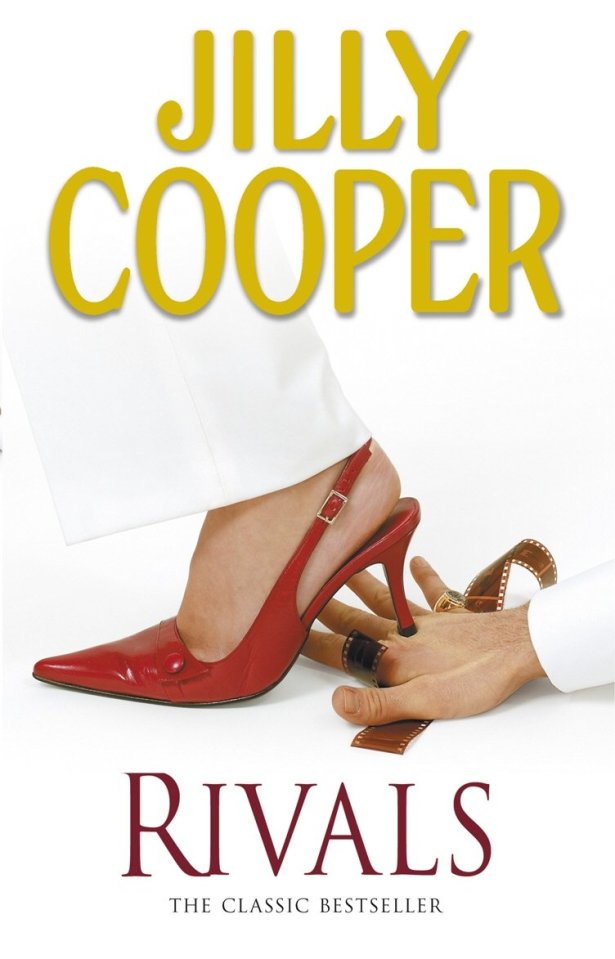 Book cover for Jilly Cooper's "Rivals" featuring a woman's foot in a red high heel stepping on a man's hand with film strip wrapped around his fingers.