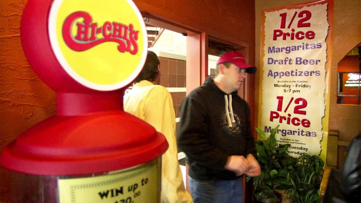 A customer enters a Chi-Chi's Mexican restaurant.
