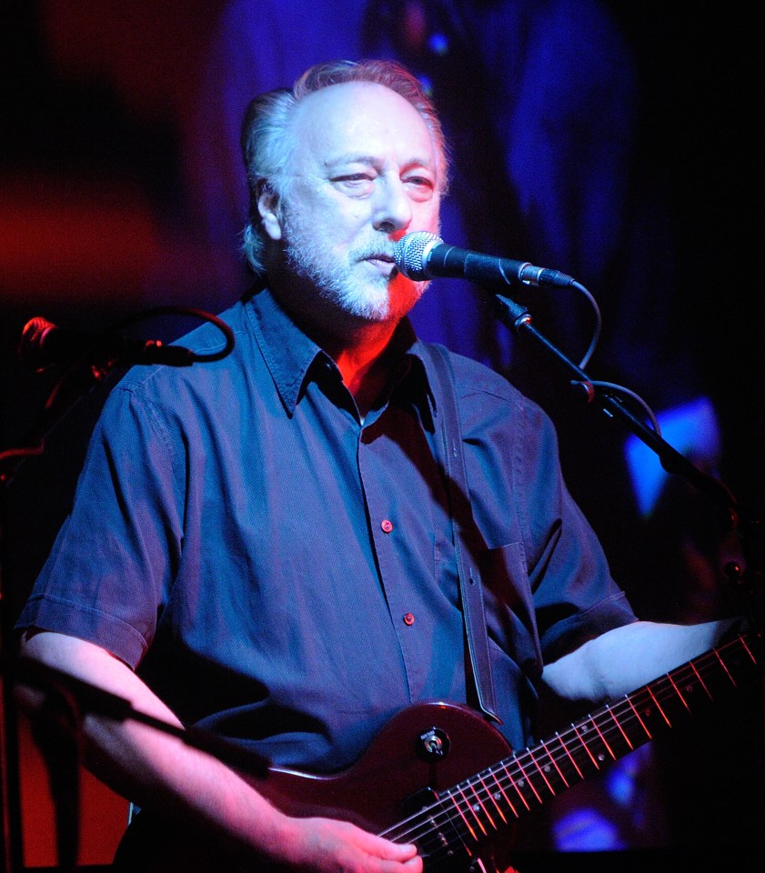 Chris Dreja of The Yardbirds performs on stage with an electric guitar.