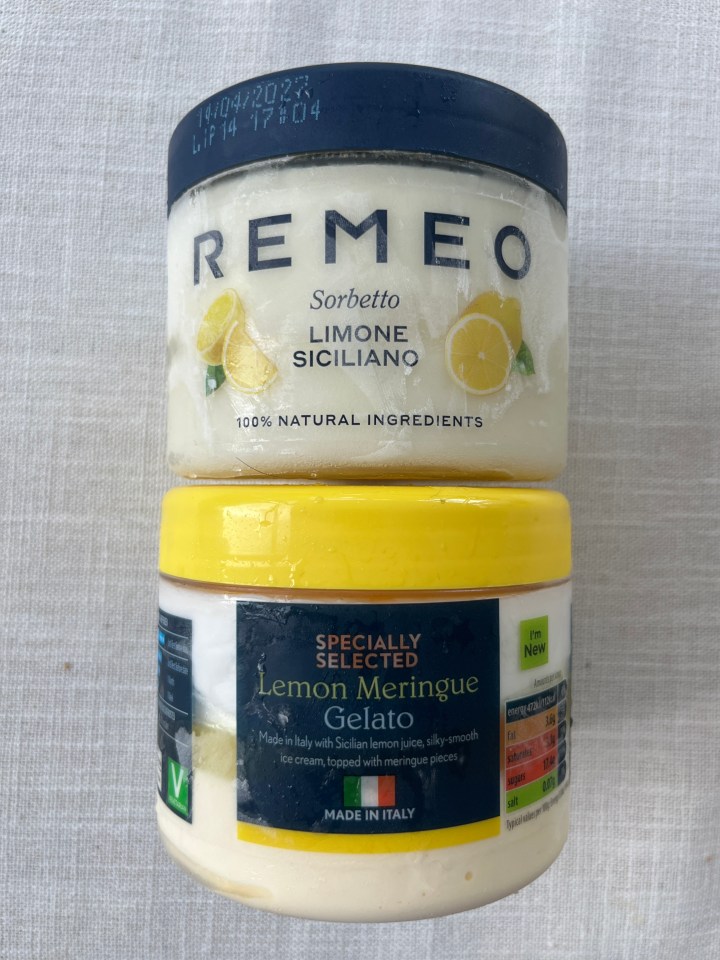 Two tubs of lemon-flavored ice cream; one is a sorbet and the other is gelato.