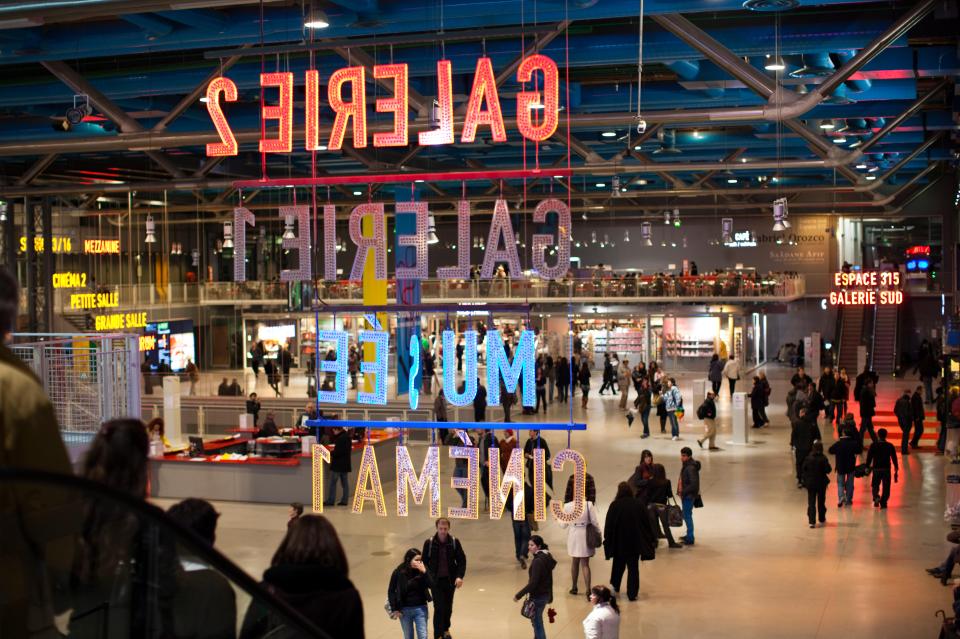 Two women take a selfie in the forum of the National Centre of Art and Culture Georges Pompidou.