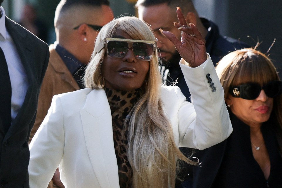 Janice Combs, mother of Sean "Diddy" Combs, arrives at court for the sentencing hearing, accompanied by a man in a suit and another woman.