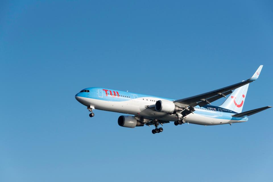 Passengers queuing to board a TUI Boeing 737 at Bristol Airport.