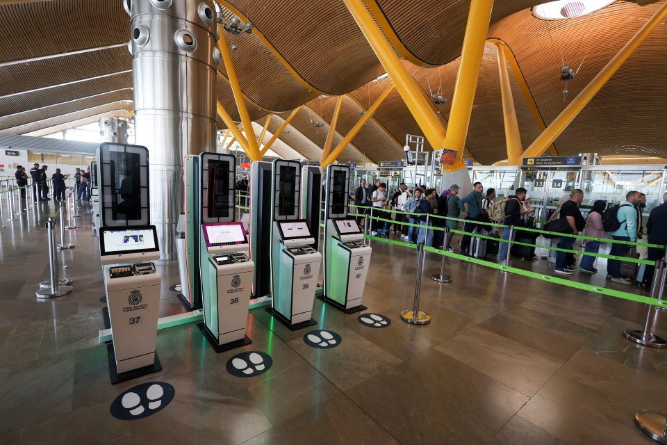 Automated European Union Entry/Exit System kiosks at Adolfo Suarez Madrid-Barajas Airport.