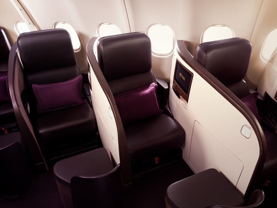 Lie-flat beds in the premium economy section of an airplane.