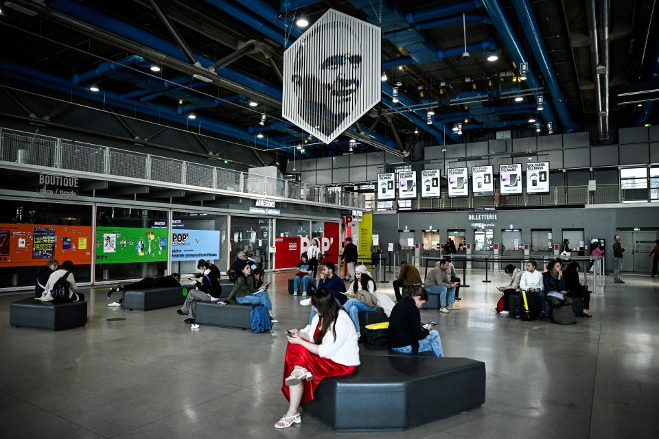 Visitors in the lobby of the National Centre of Art and Culture Georges Pompidou.
