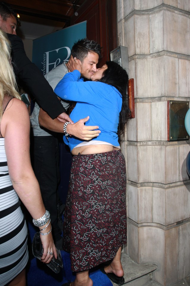 Peter Andre kissing a female fan.