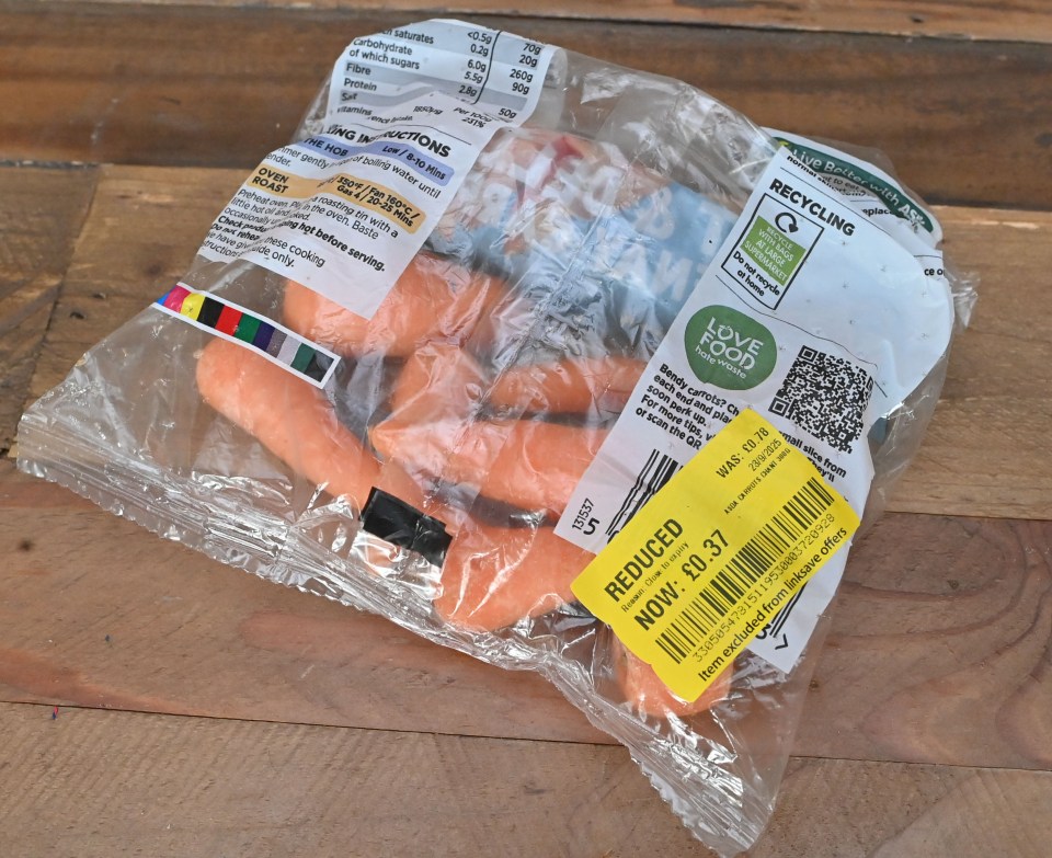 A bag of carrots with a yellow reduced price sticker showing the new price of £0.37.