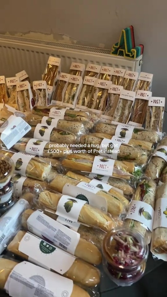 A table filled with numerous packaged Pret A Manger sandwiches, baguettes, wraps, and salads.
