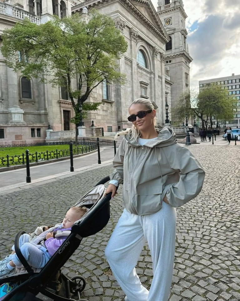 Molly Mae with her baby in a stroller in Budapest.