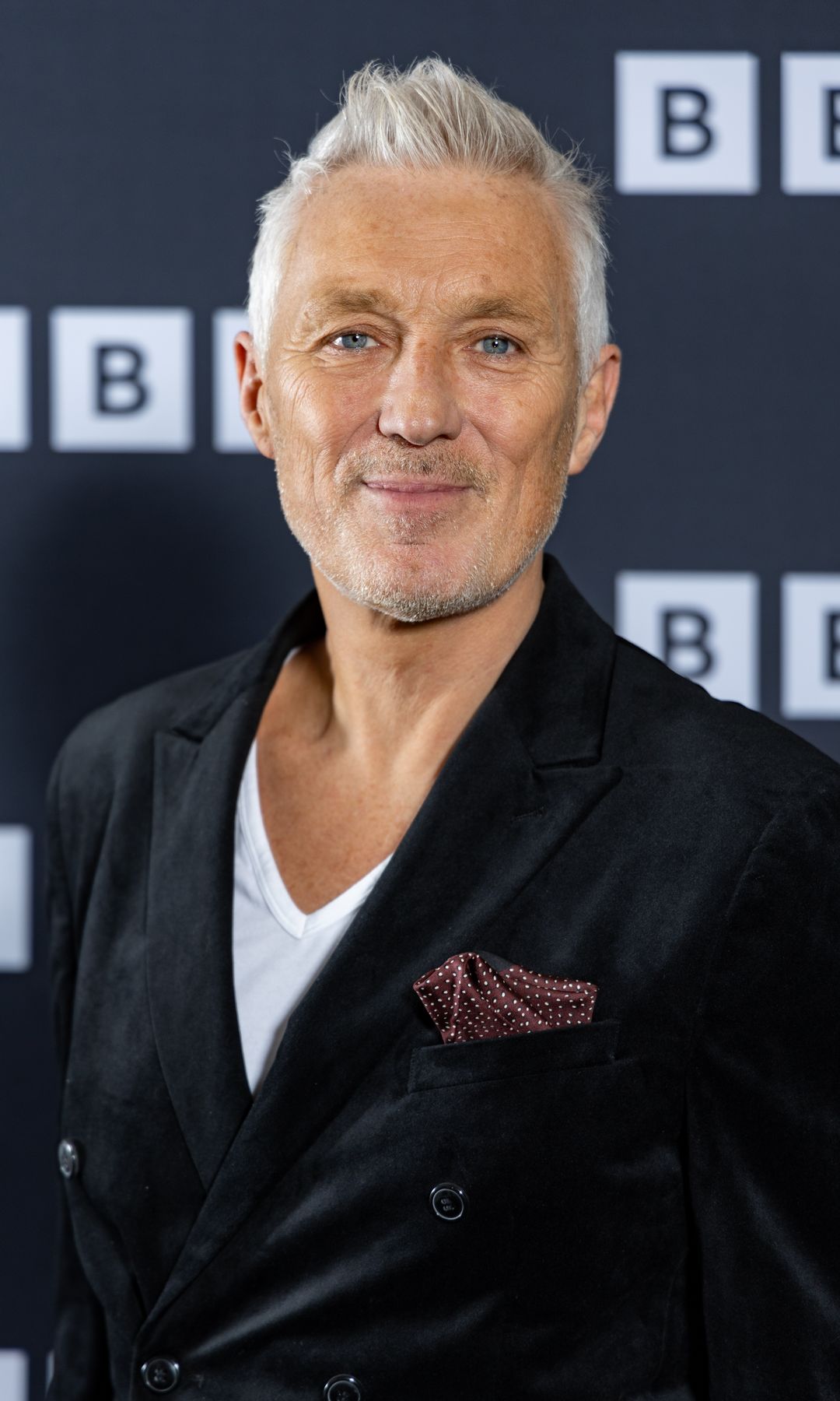 Martin Kemp in a black suit