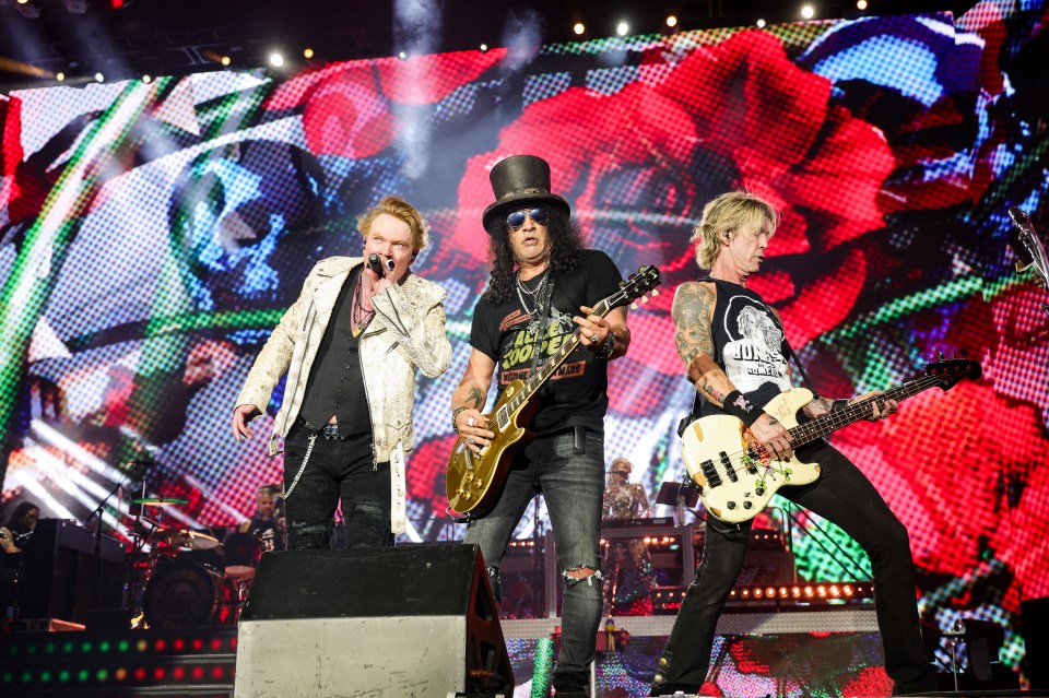 Axl Rose, Slash, and Duff McKagan perform onstage during the Power Trip music festival.